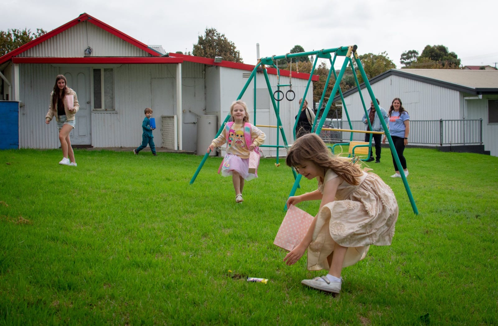 Children playing outdoors on the lawn / victor harbor