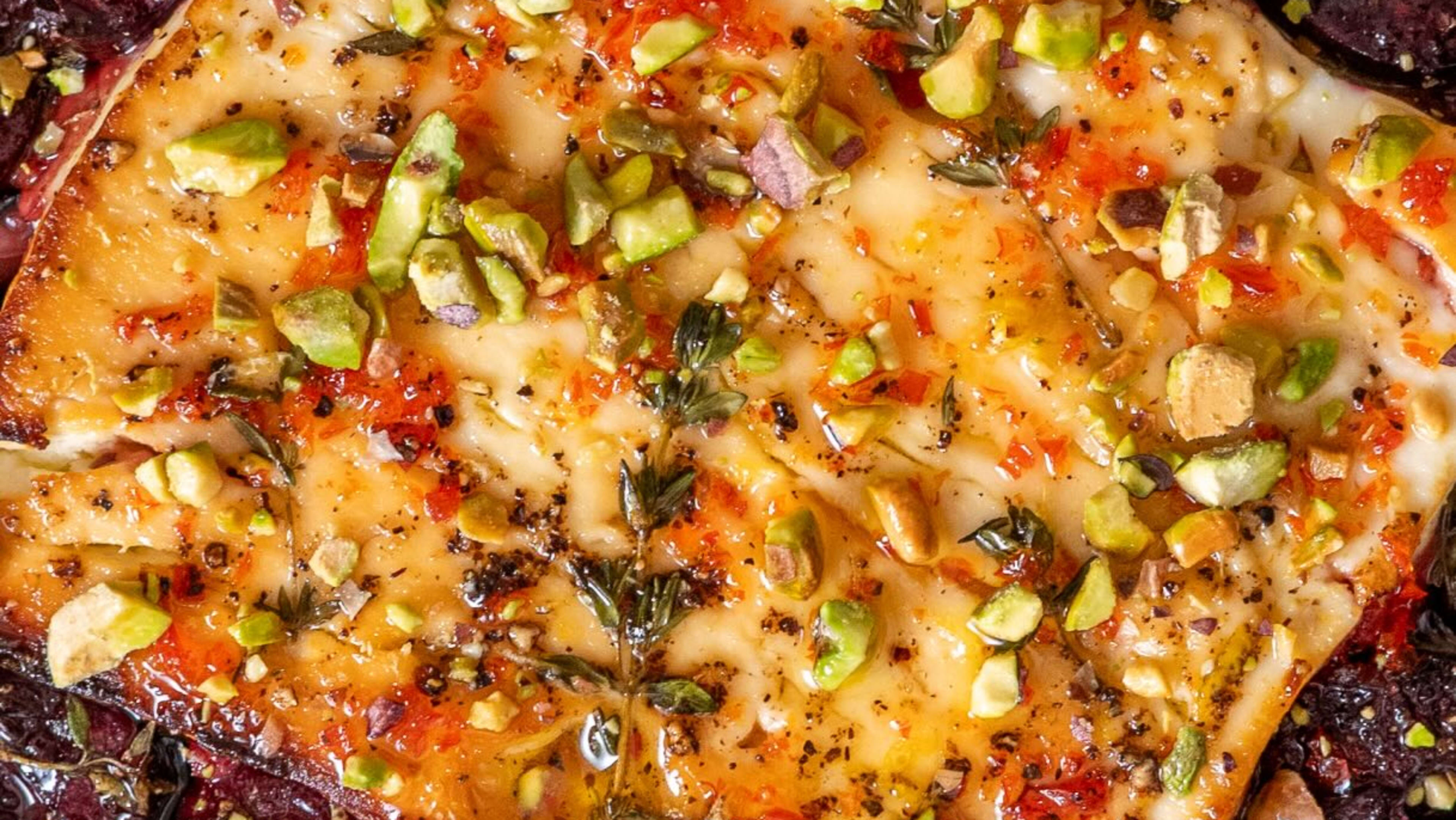 Baked Feta with Jammy Cherries, Hot Honey, Pistachios and Crispy Garlic