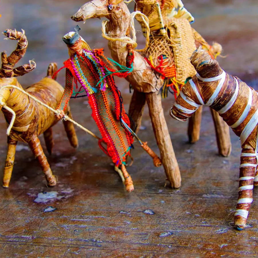 Handcrafted figurines made from natural materials like straw and wood., photo 1