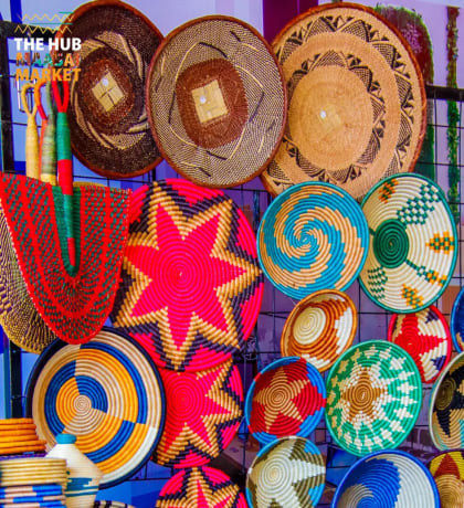 Colourful woven baskets on a wall