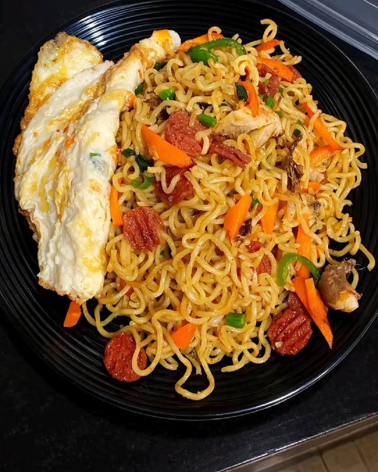 Indomie with veggies and Fried eggs