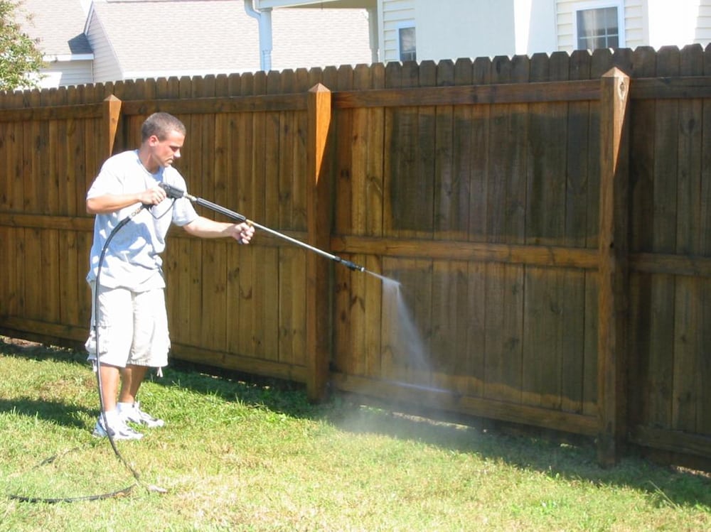 Reclaim Bros pressure washing fence restoration
