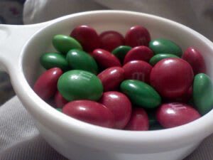 Bowl of green and red M&Ms - like the odds of winning a prize with lottery scratchers