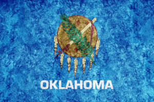 <a href="https://www.freepik.com/free-photo/metallic-oklahoma-state-flag-oklahoma-flag-background-metallic-texture_24572165.htm#query=oklahoma&position=9&from_view=author">Image by Allexxandar</a> on Freepik