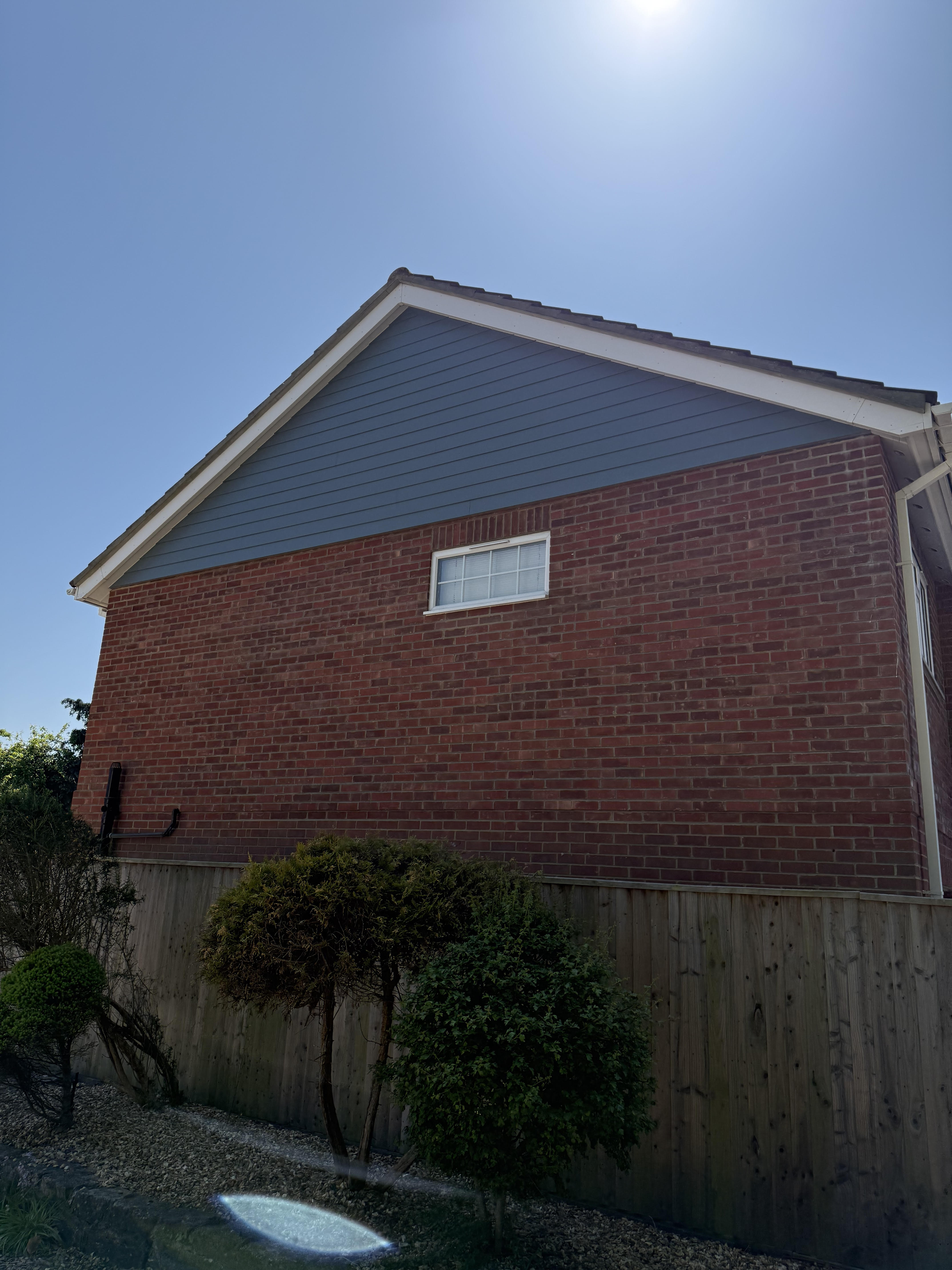 Coloured cement board fitted to gable in Highcliffe