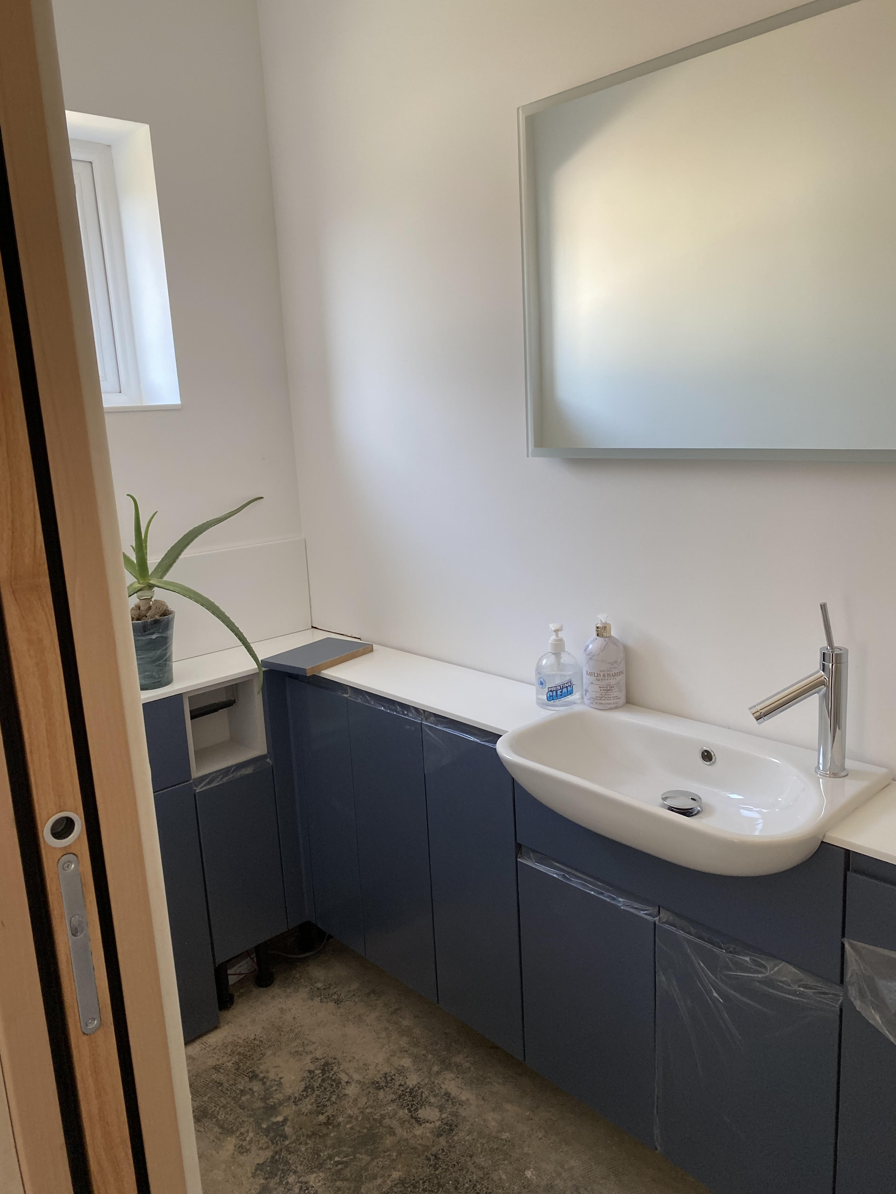 Downstairs WC with built in furniture