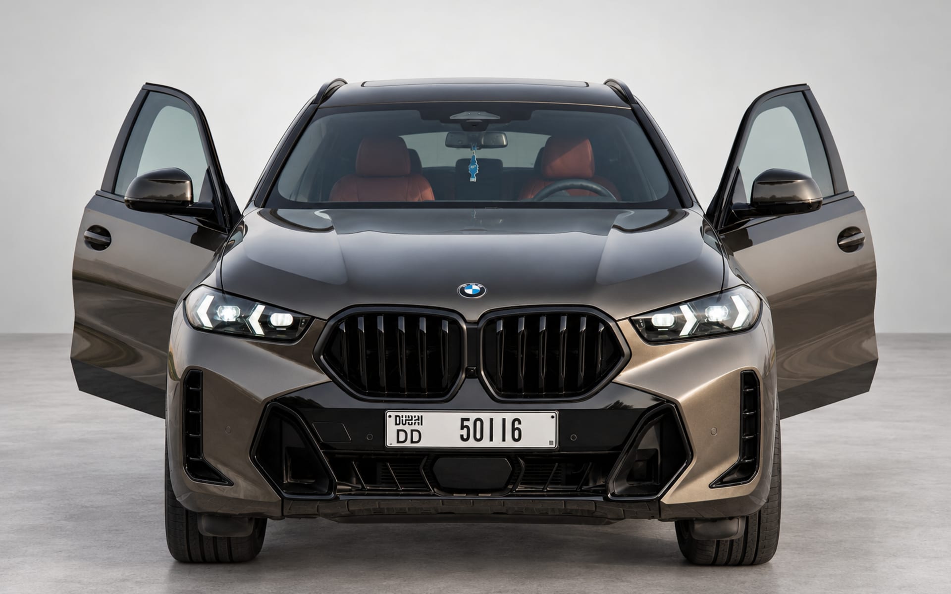 BMW X6 2026 Brown front view with doors open