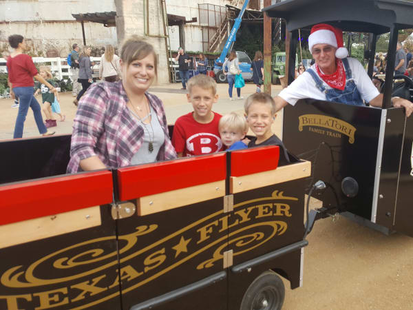 Kids aboard the Texas Flyer trackless train