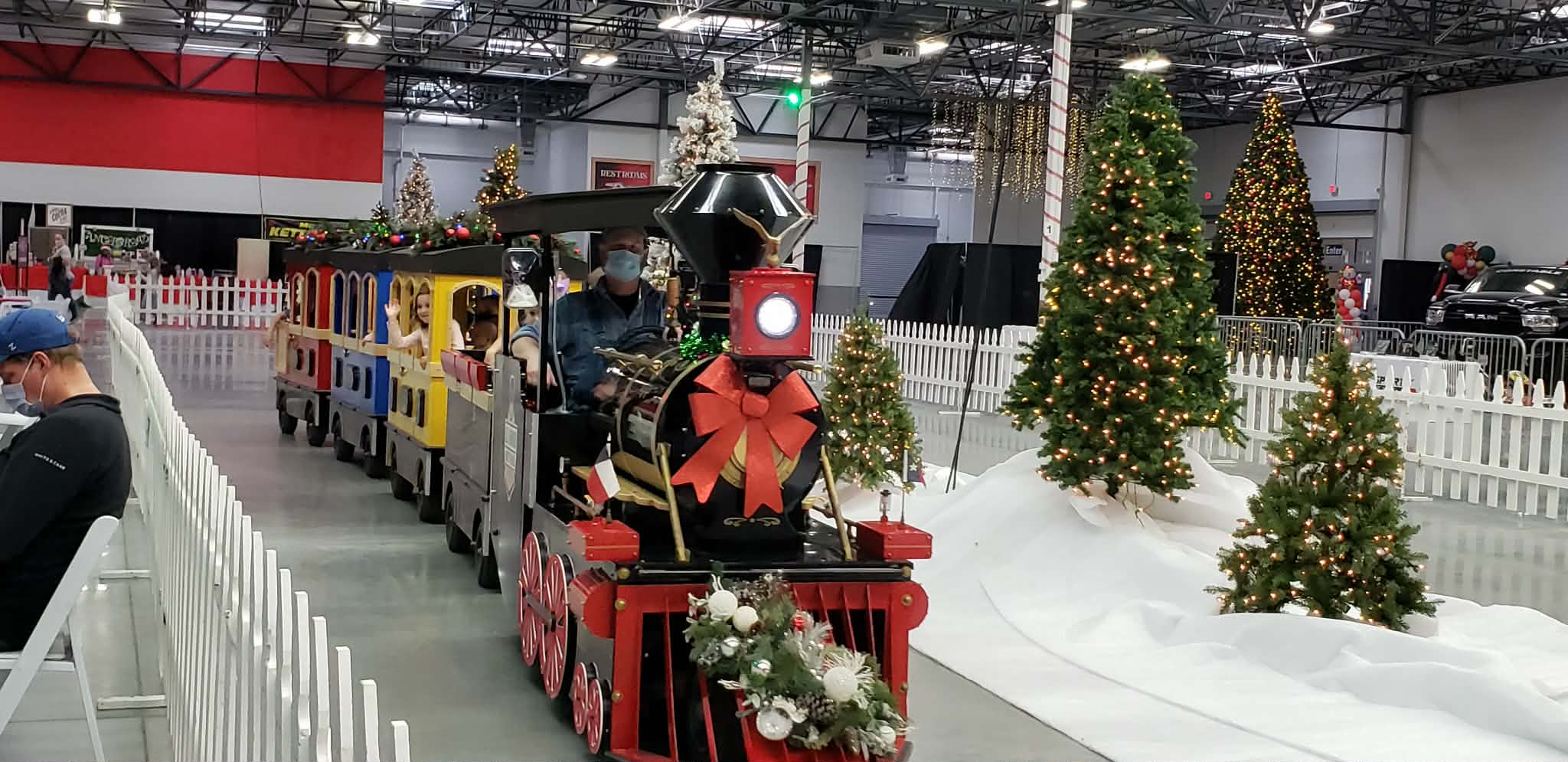 The Texas Flyer trackless train decorated for a Christmas event