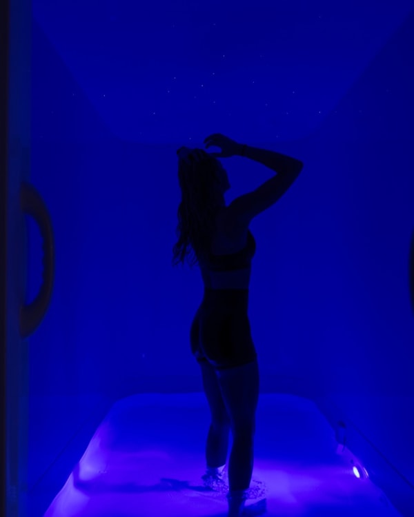 Guest stepping into the float pod
