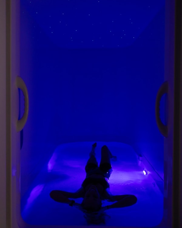 Guest floating with the pod door open