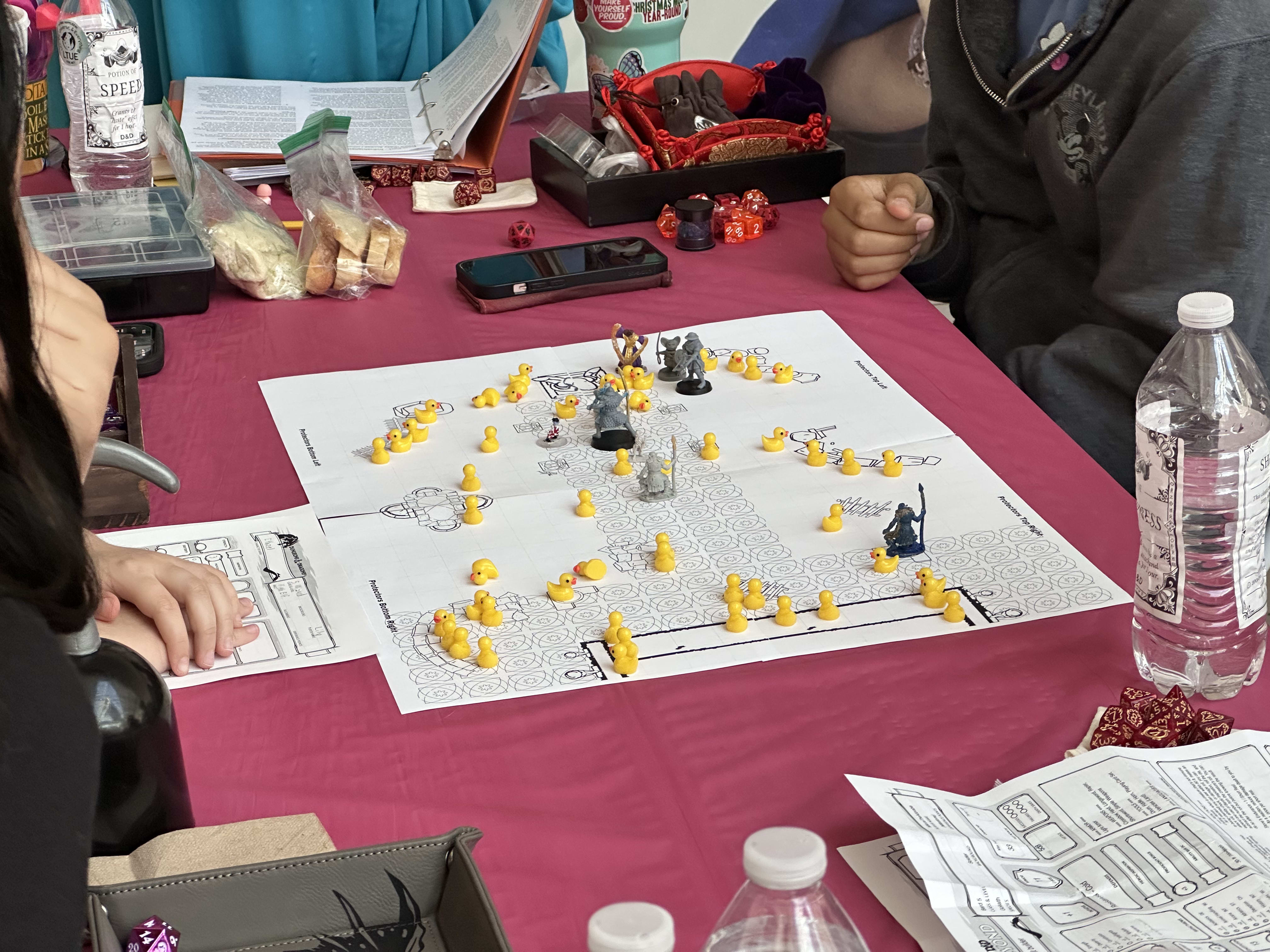 Gamers get creative, with custom miniatures designed for the event, or whatever they have handy.
