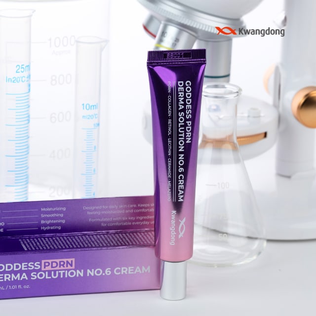 This staged image features the high performance Goddess PDRN Derma Solution NO.6 Cream placed against a laboratory background with beakers and a microscope. It highlights beauty tech and research-based innovative technology, while the purple tube package creates a luxurious and professional image.