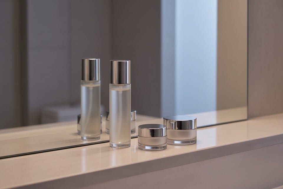 A skincare routine scene with basic skincare products such as essence and serum arranged together