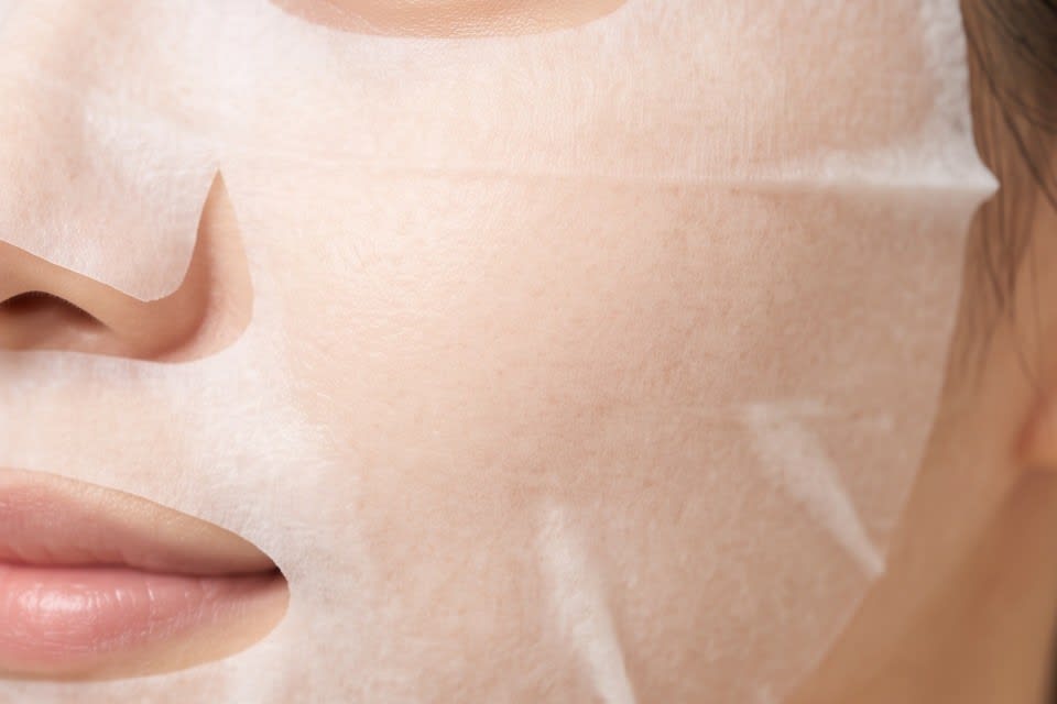 A sheet mask fully adhered to the skin
