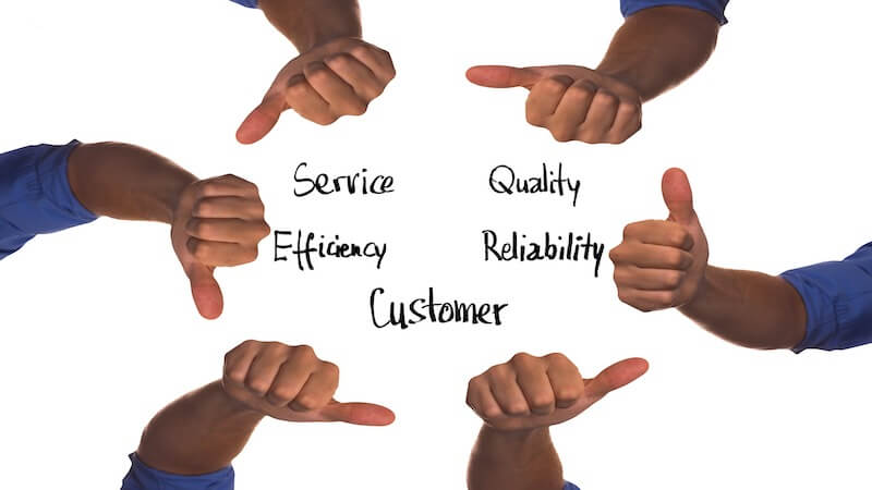 The image shows six people with their thumbs up making a circle. Inside the circle it's written the words "service, efficiency, customer, reliability".