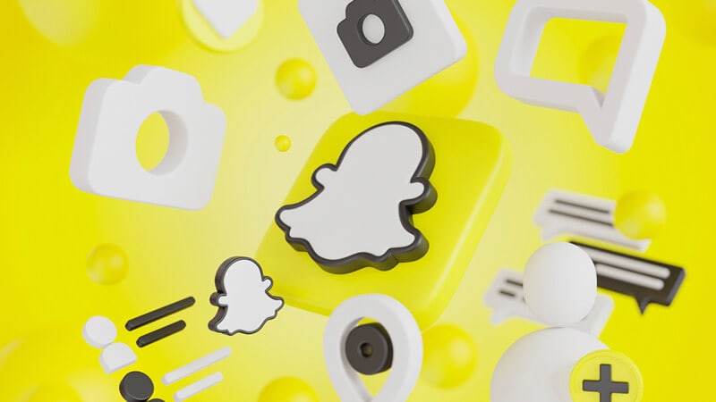 Foto de uma tela com o fundo amarelo e a logo do Snapchat
