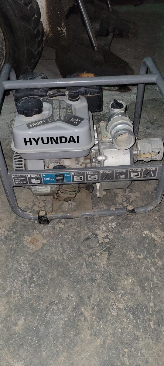 Discharge water pump with hoses — photo 1