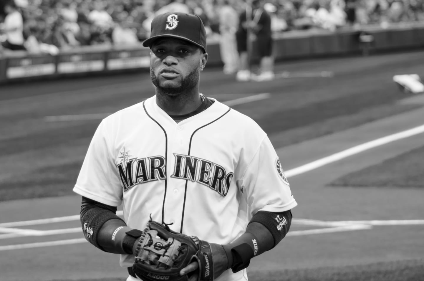 Color photo of a Mariners player in batting stance, focused and ready