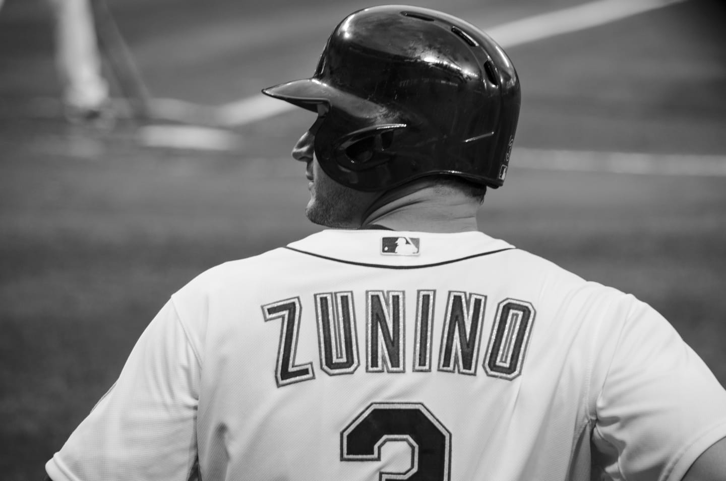 Black and white photo of Mariners catcher Mike Zunino in full gear ready behind home plate