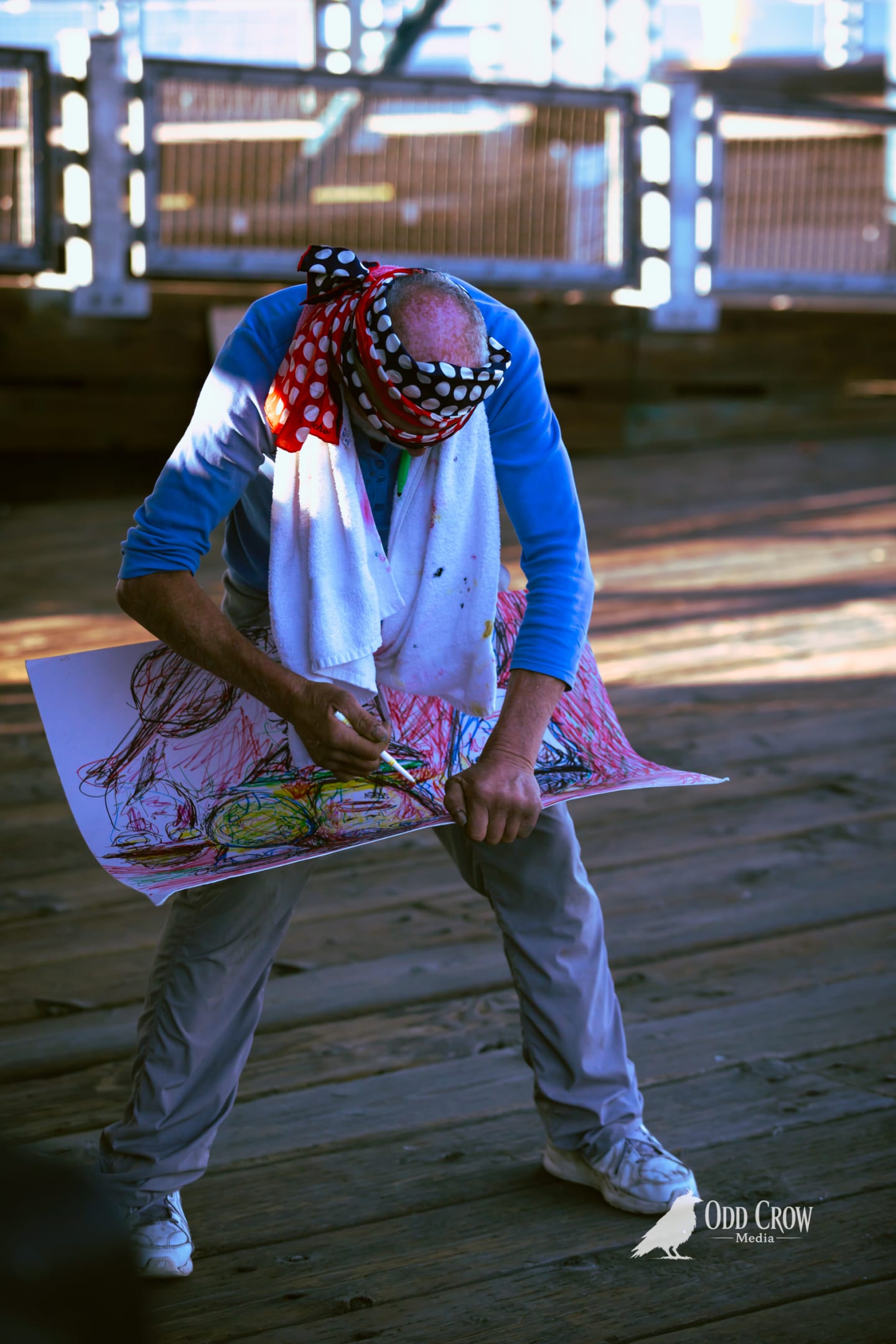 A street artist sketching on the Port Angeles pier during Day of Play Festival