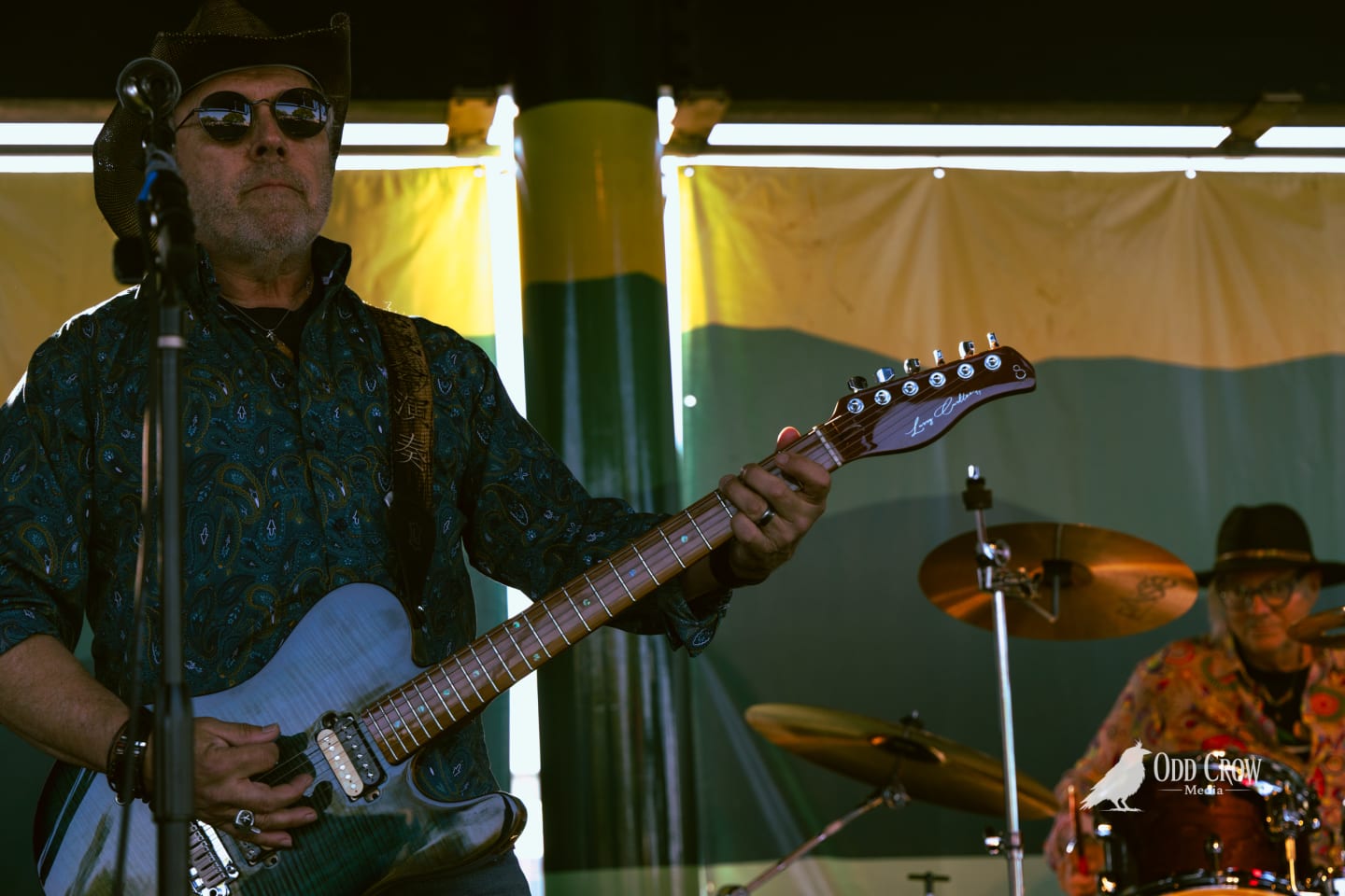 Guitarist and drummer of Reckless Dove performing together on the pier stage