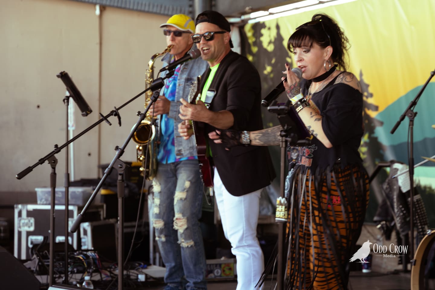 Saxophone player, guitarist and female vocalist sharing the stage