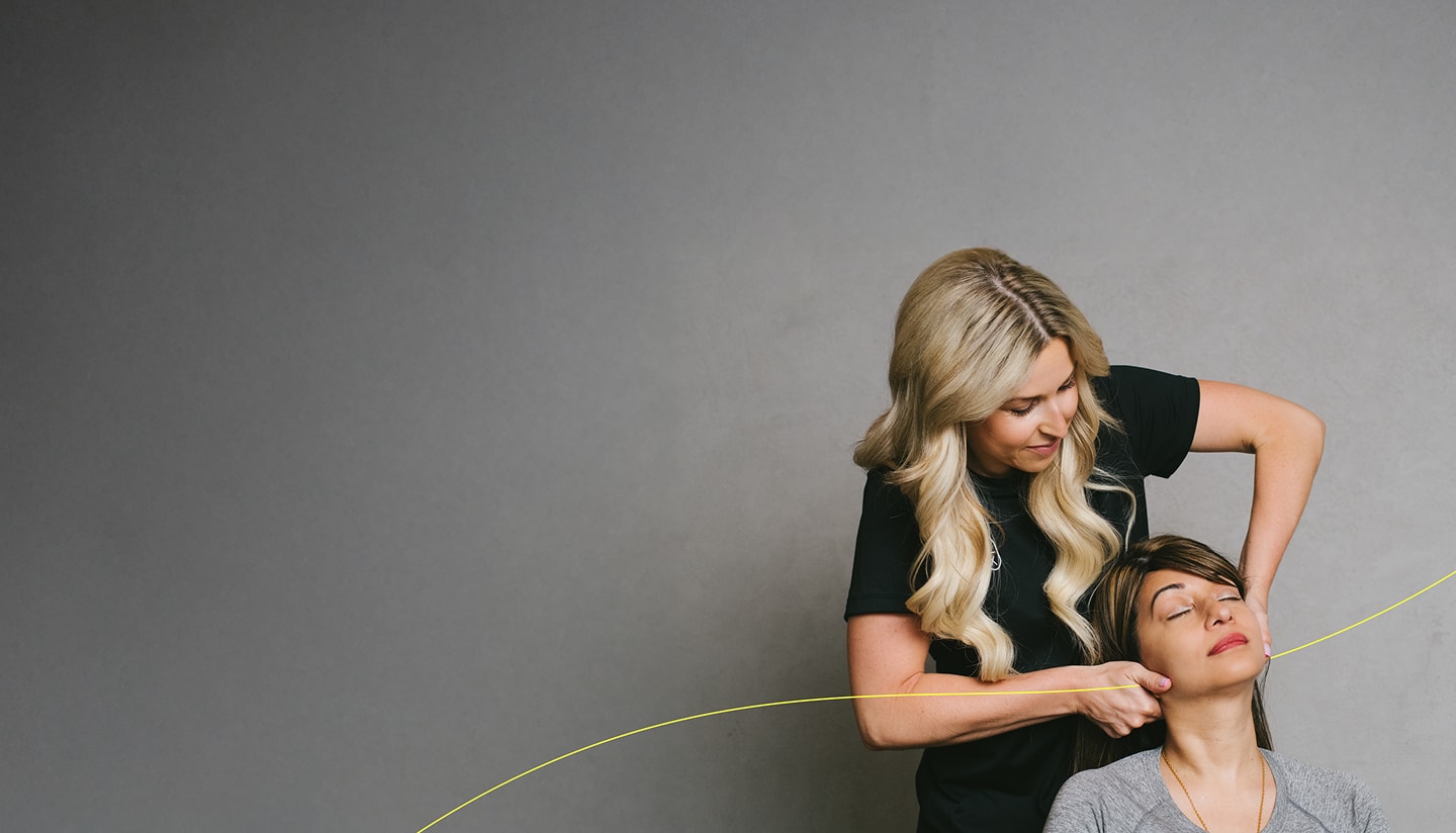 Chiropractor assisting patient with chiropractic care.
