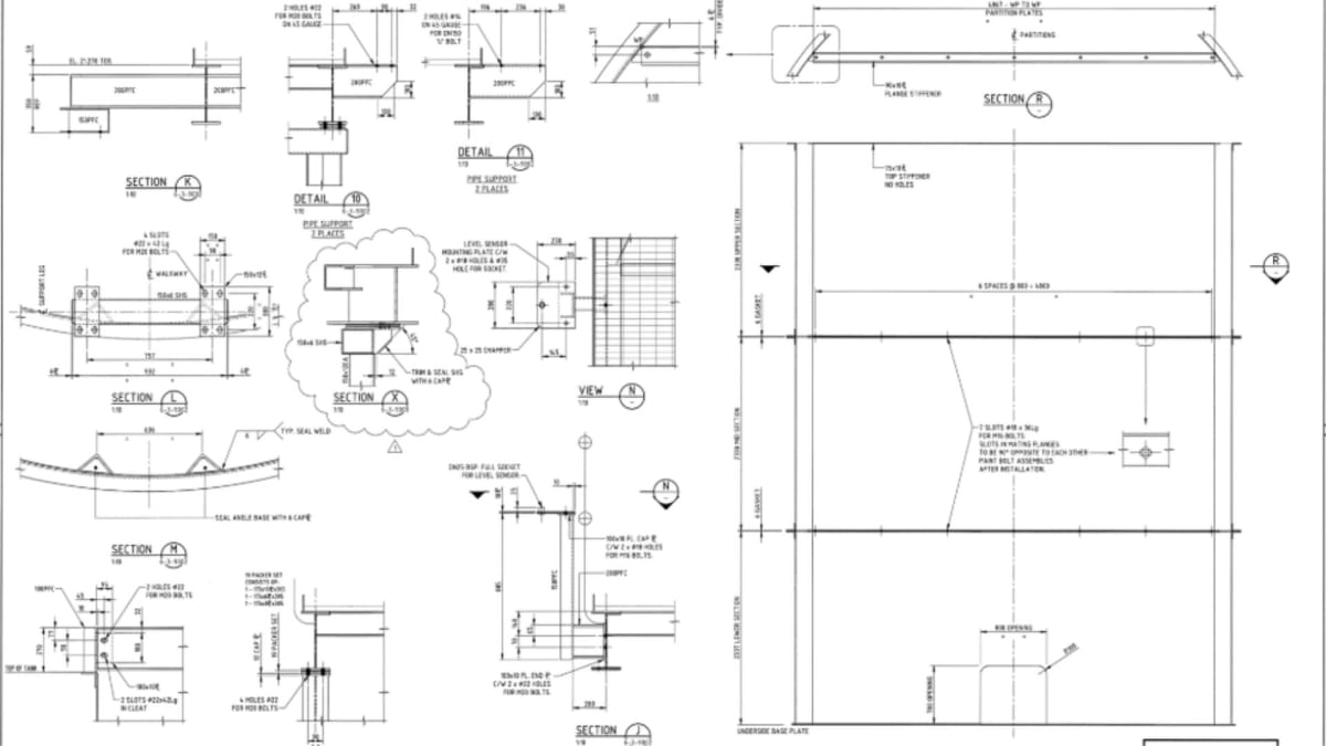 Field technician consulting engineering drawings in an industrial plant