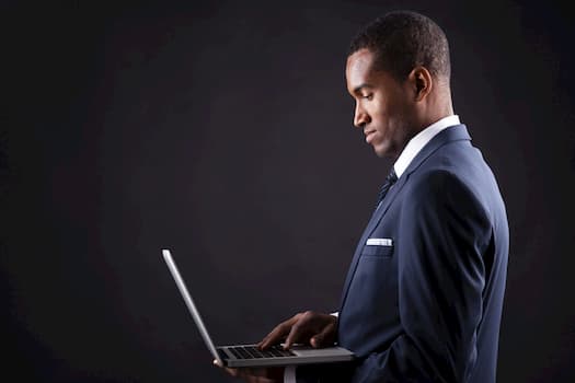 man looking at laptop screen