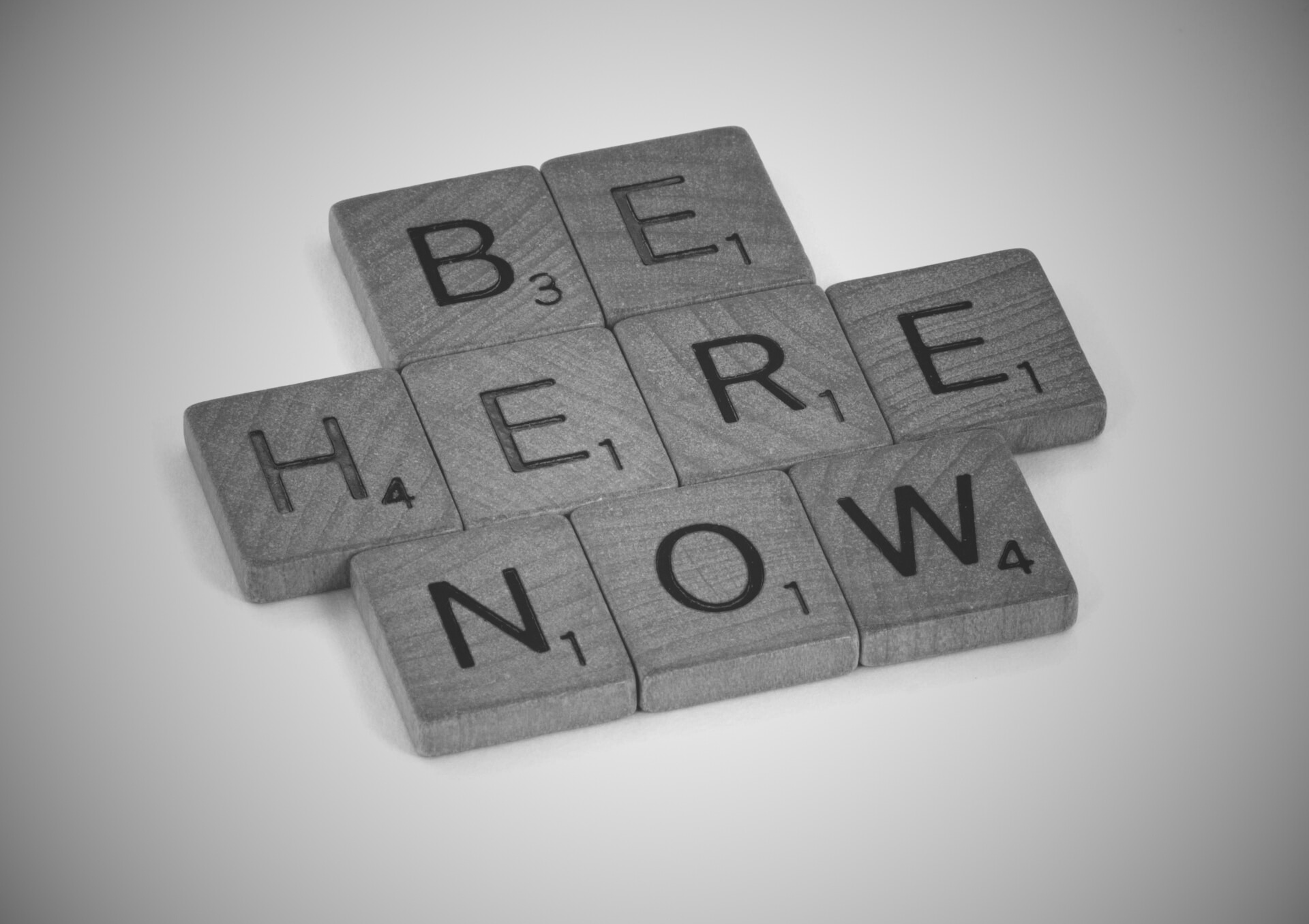 Scrabble Board Saying Be Here Now