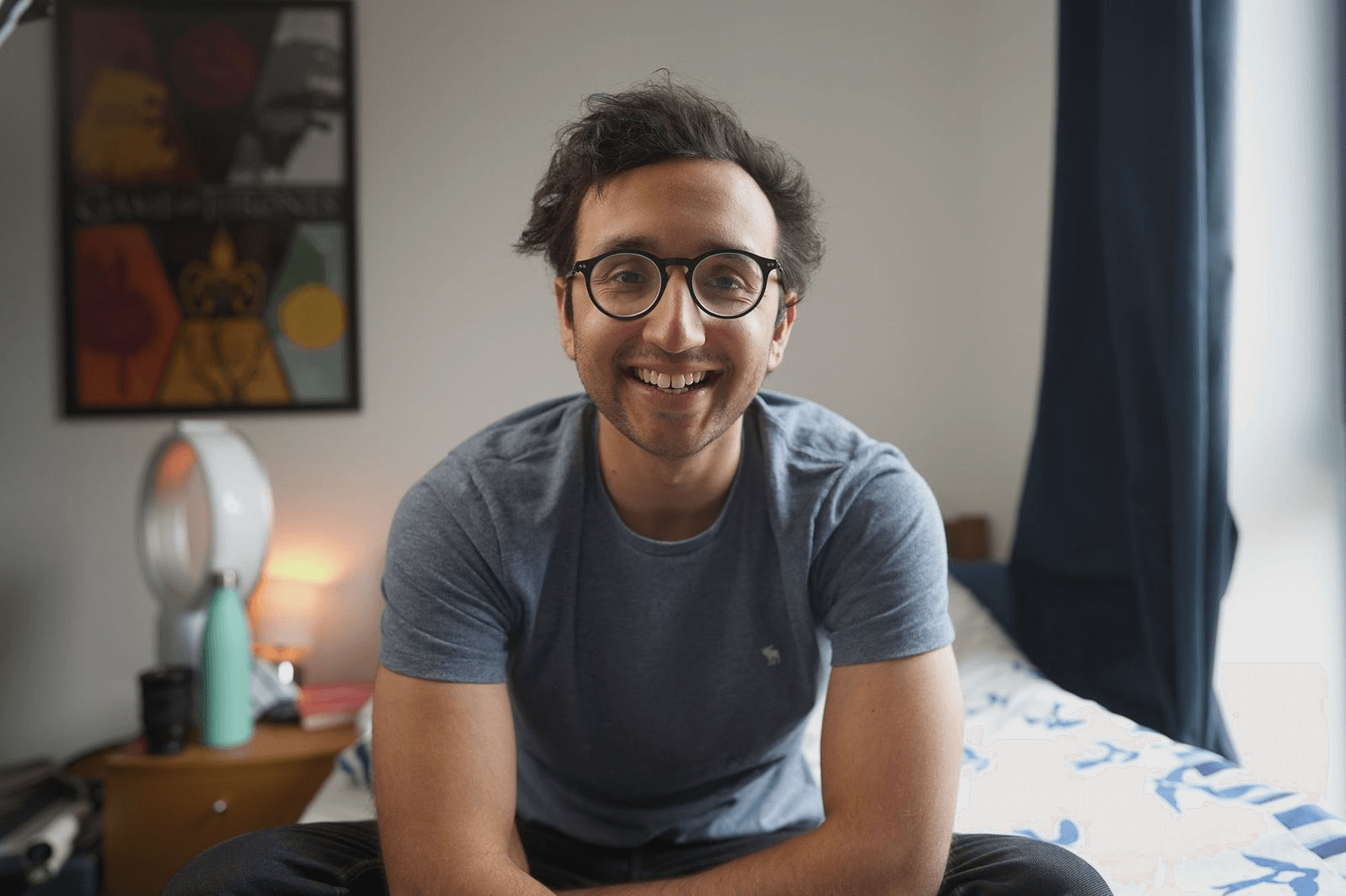 ali abdaal sitting and smiling