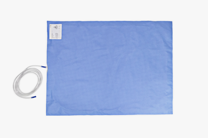 Typenex Medical Fluid Fighter Suction Mat attached to tubing. Blue, rectangular, absorbent material, 47 by 35 inches.