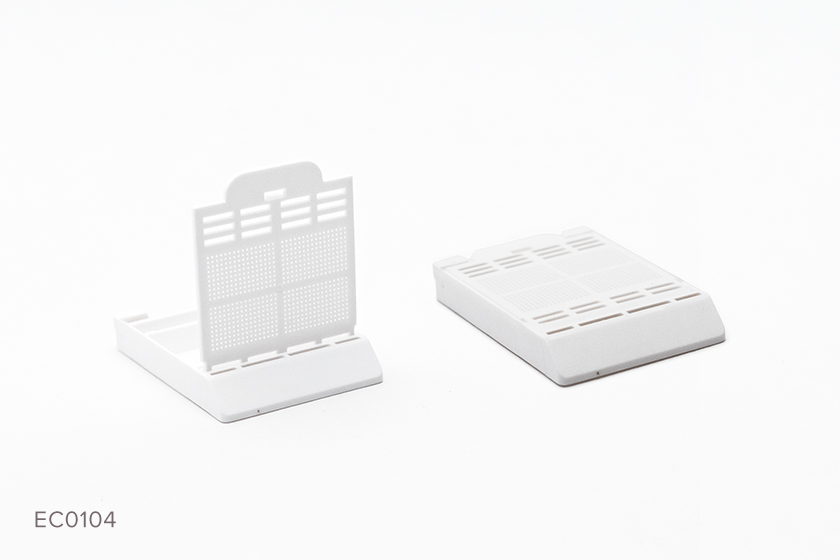 Two Typenex Medical Histology Biopsy Cassettes in white (ECO0104). Front hinge, lid attached, .26 x .26 mm.