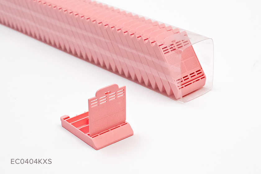 Packaged sleeve of pink Typenex Medical Histology Biopsy Cassettes (ECO0404KXS). Front hinge, 4 compartments.