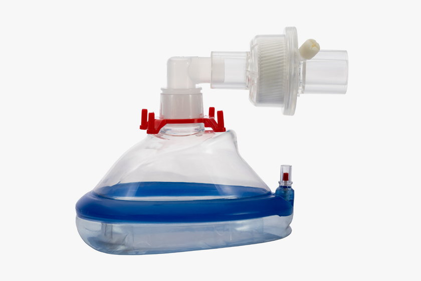 Clear anesthesia breathing mask with blue padded rim.