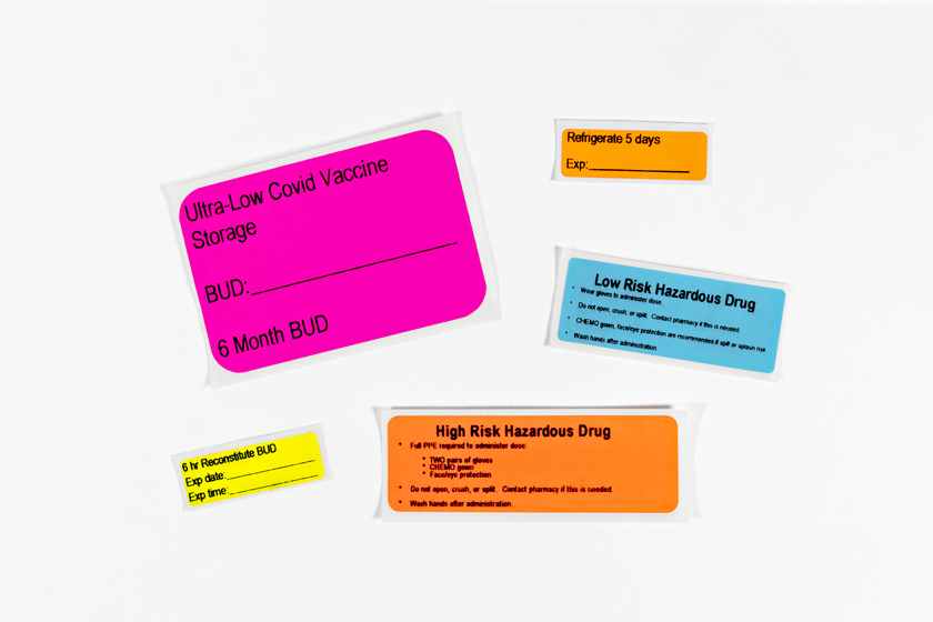 Assortment of Typenex Medical Xpress hospital communication labels varying in size, color, and printed text.