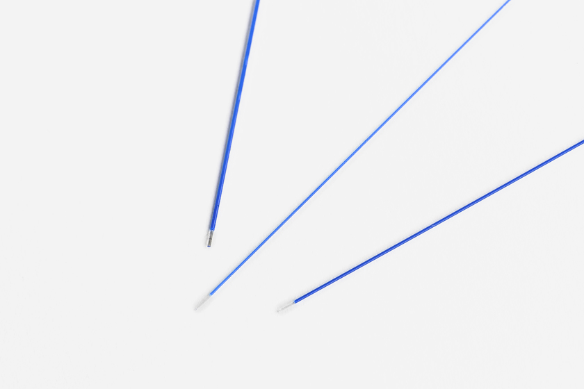 Blue Typenex Medical Fibernex endovenous laser fibers. Standard size, thin-wall, and round-tipped edges shown for comparison.