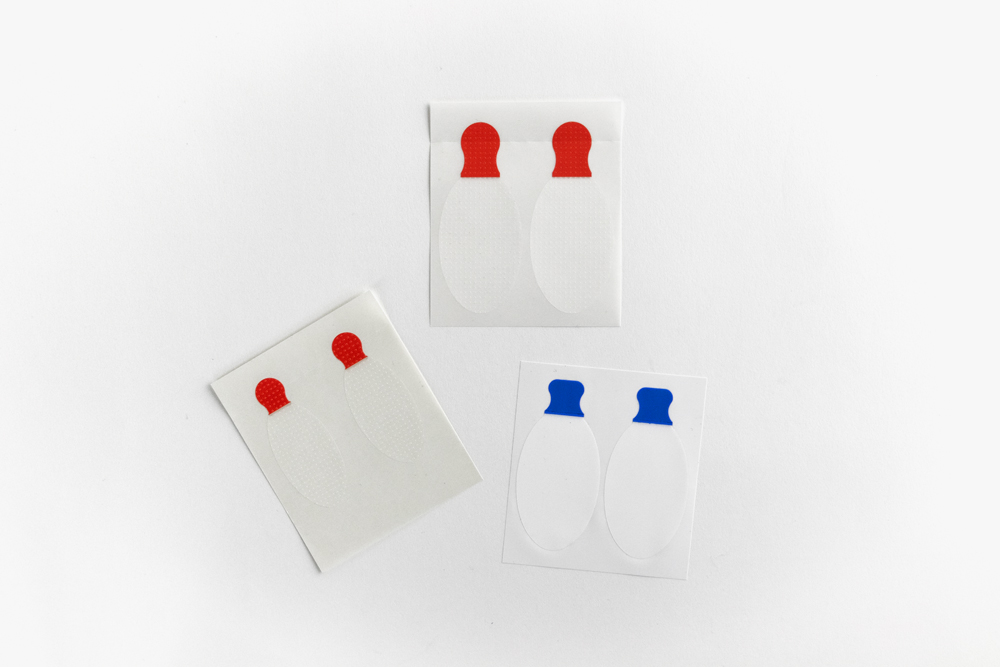 Eye Safety Tape by Typenex Medical. Two pediatric pairs and one standard adult set displayed for size comparison.