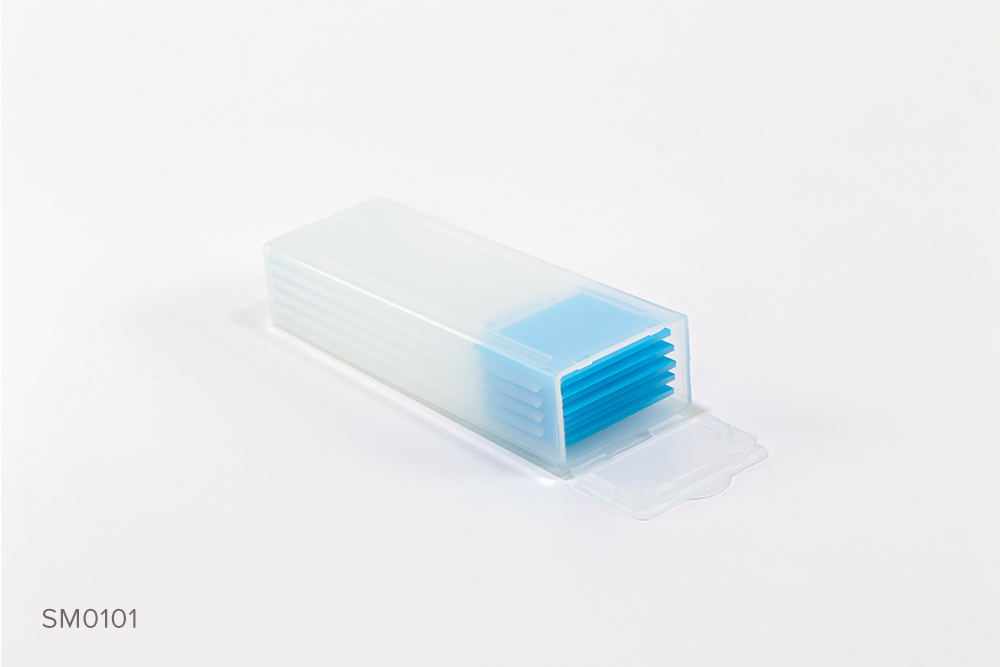 Typenex Medical's clear plastic microscope slide mailer case containing five microscope slides with blue color-coded ends.