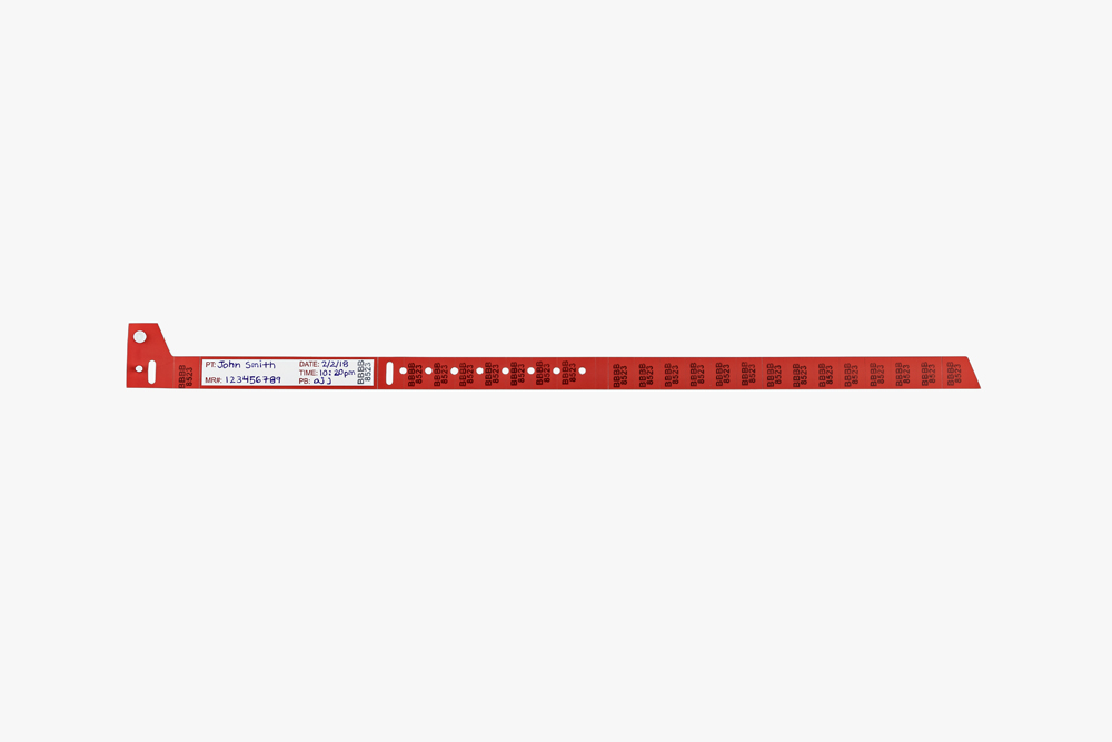 Red Typenex Medical non-barcoded Slim 3 blood band (AB0101R) with handwritten patient data and unique BBID.