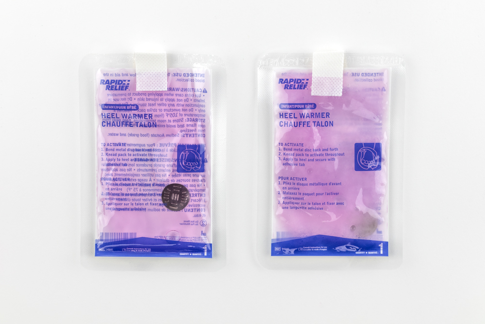 Two Typenex Medical Infant Heel Warmers, side-by-side.