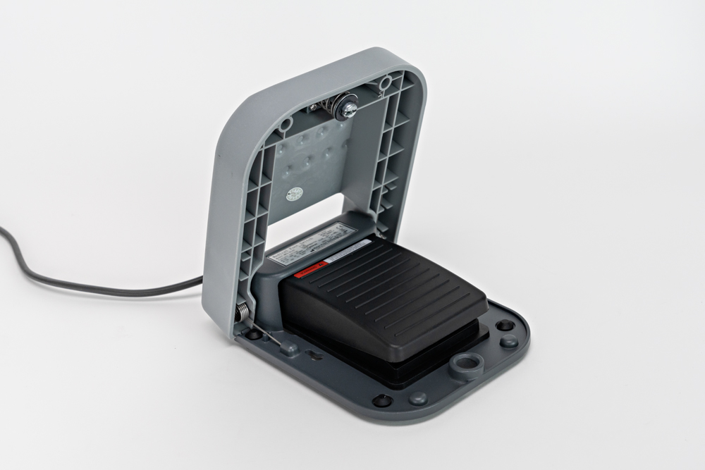 Fibernex Go Laser Generator unit’s foot switch, with the safety cap open.