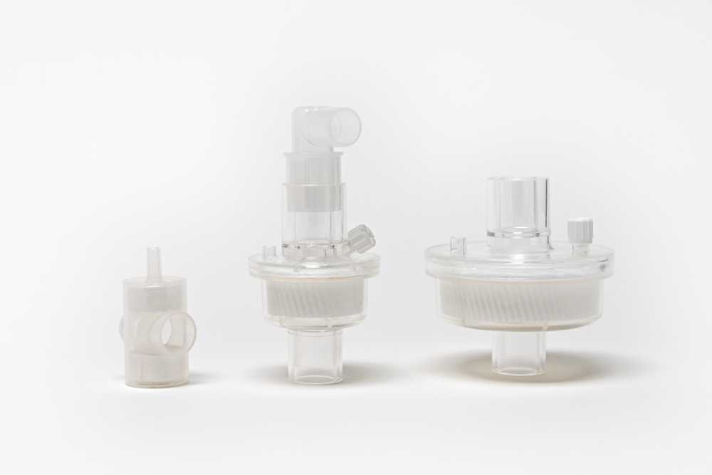 Assortment of breathing circuit filters in varying sizes. Two bacterial/viral filters and one trach HME.