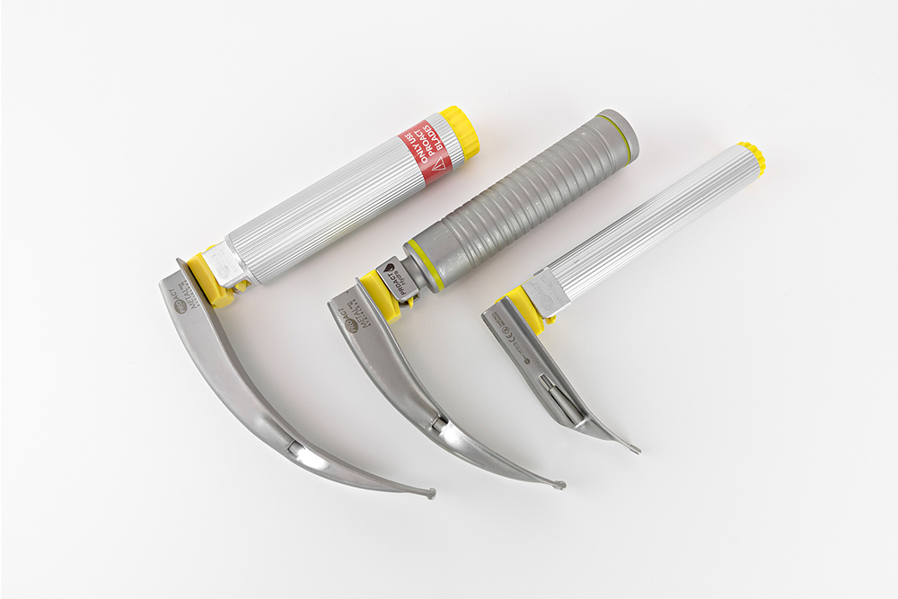 3 Typenex Laryngoscope blades and handles in various sizes.