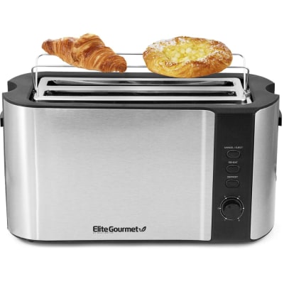 Elite Gourmet ECT-3100 long-slot toaster with built-in warming rack raised above the extra-wide slot, holding a croissant and a Danish pastry — stainless steel body with Reheat, Defrost, and Cancel controls