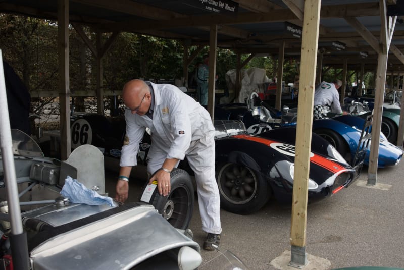 Working on a car in the paddock at Goodwood Revival