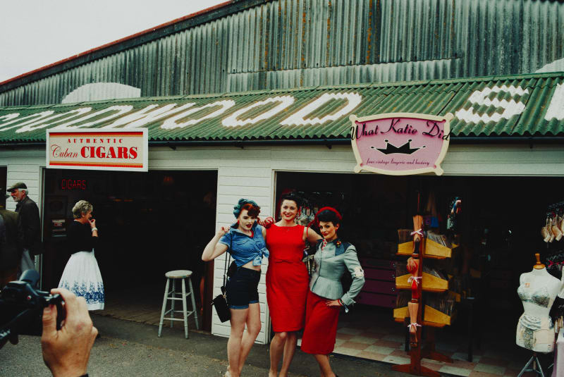 Three girls in costume at Goodwood Revival