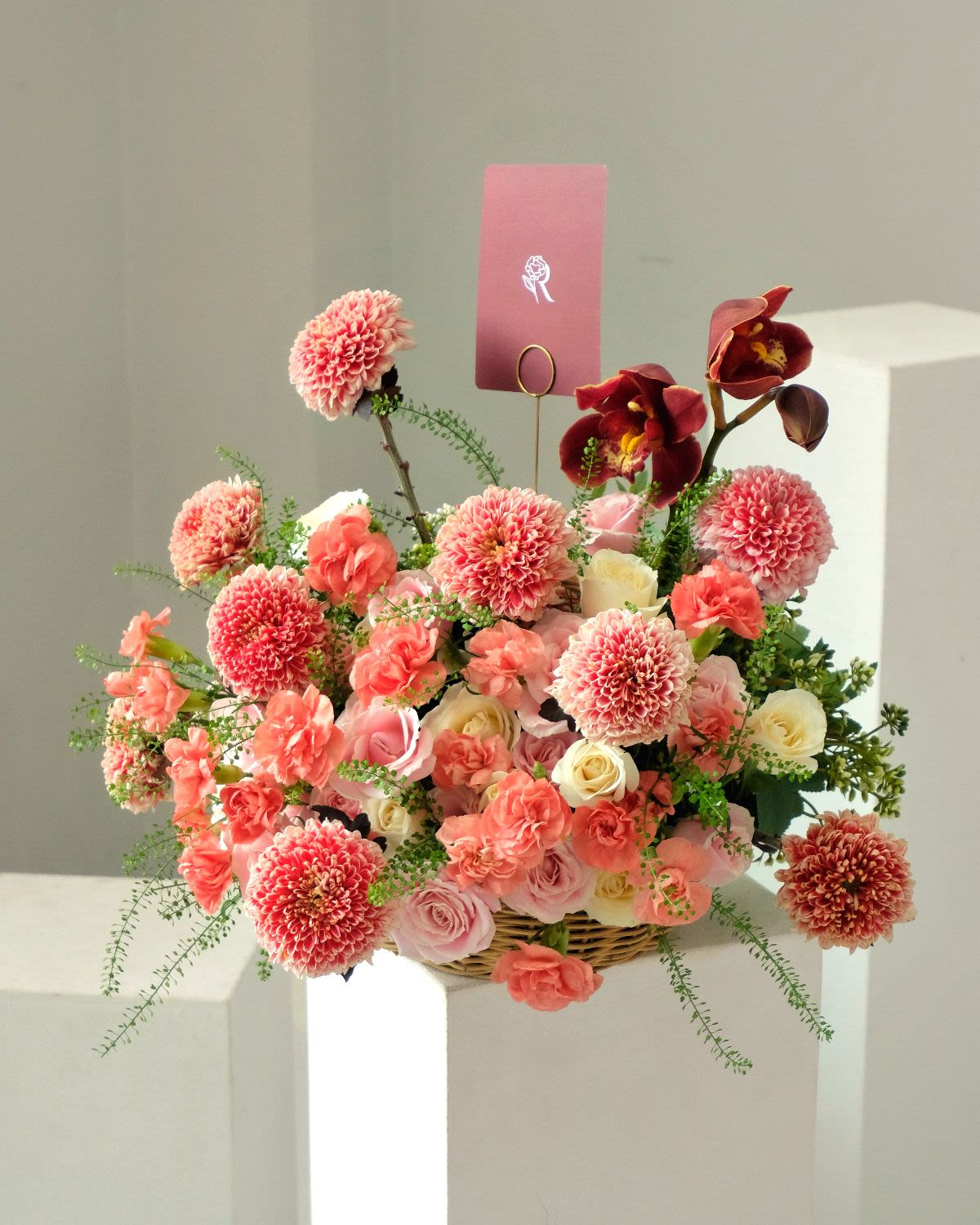 The Coral Bloom - Pink & white roses with gompie, red cymbidium & carnation — warm coral bloom. - Rena The Blossom Jakarta