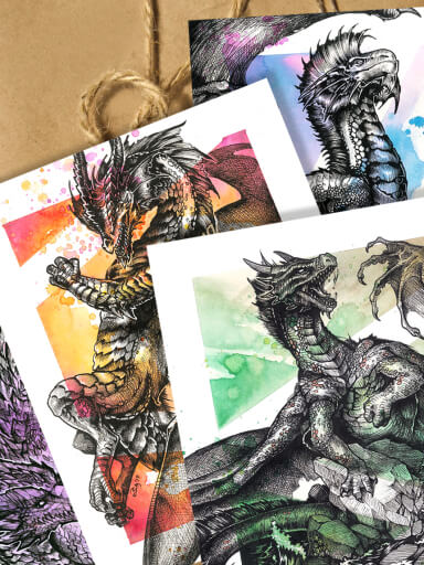 A set of inked dragons with colorful watercolour backgrounds, in front of a kraft paper package